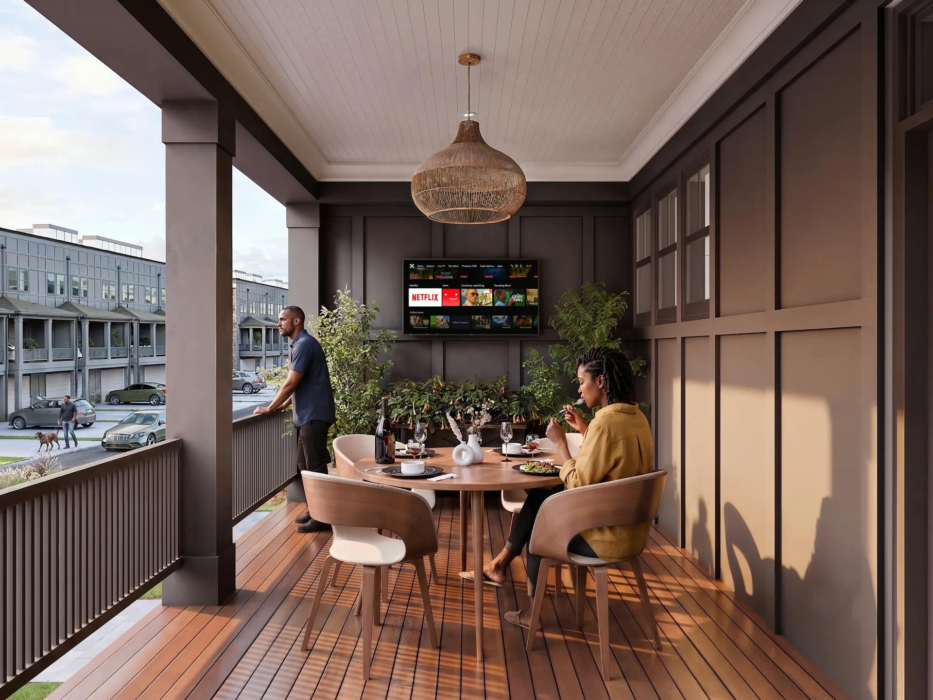 Covered porch with a table, seating and a view of the street