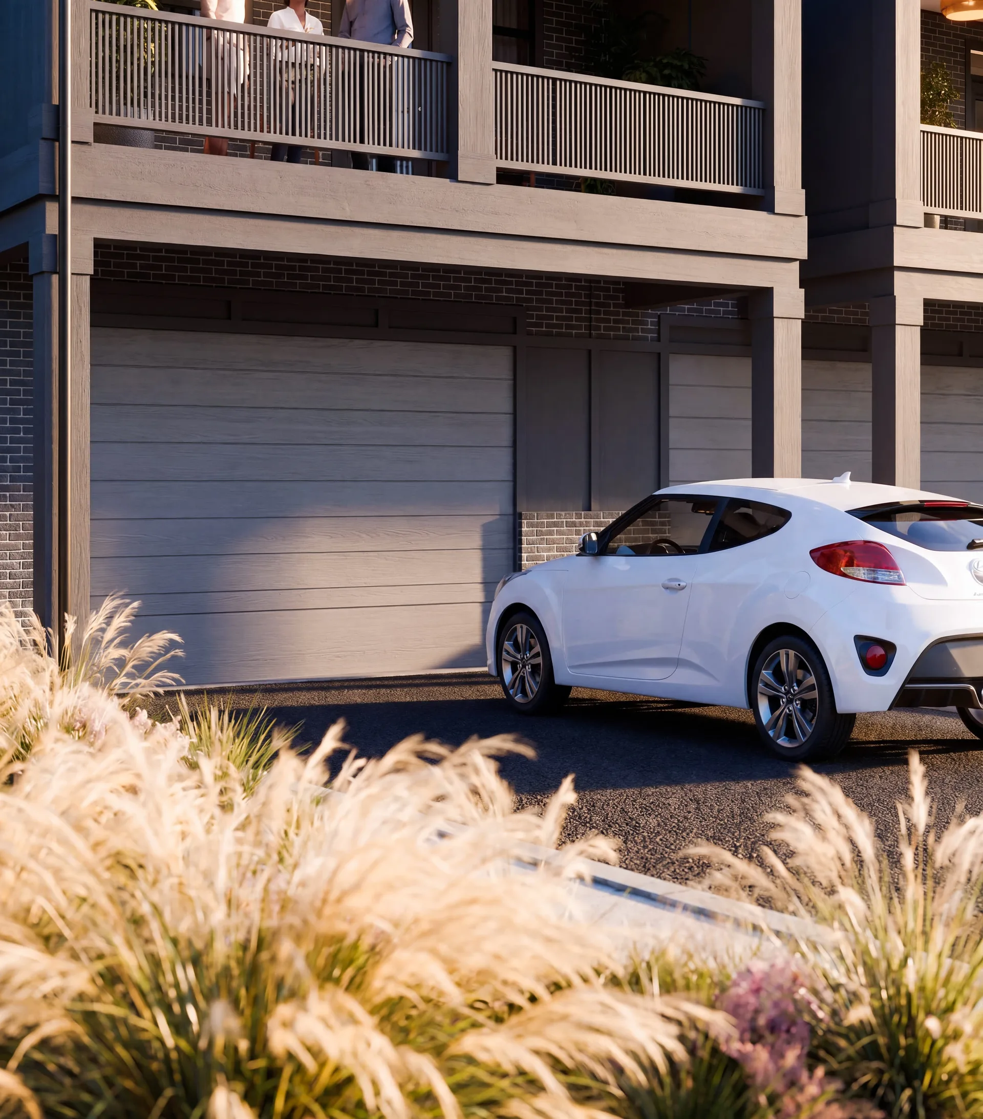 Close view of the rear facade, garage doors and driveways